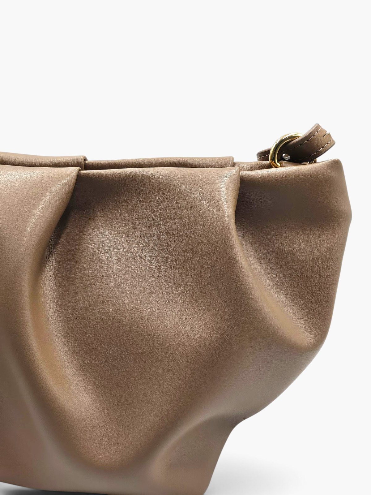 Close-up of the hand-pinched pleats along The.Chai's flap