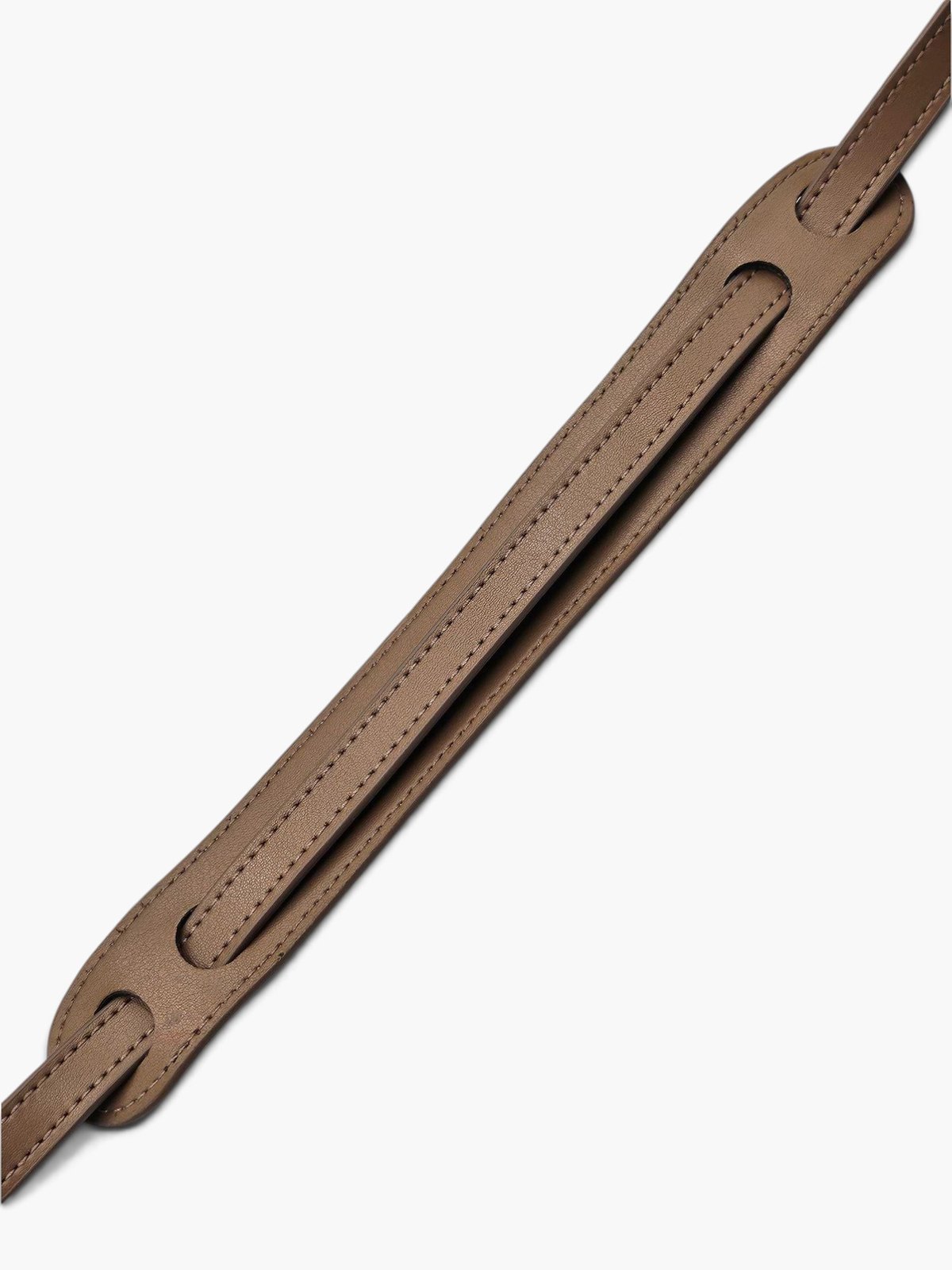 The.Chai's strap laid flat, showing its stitched edge